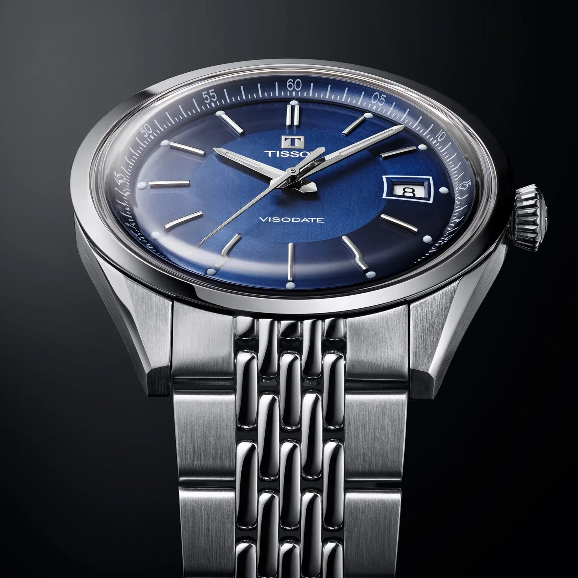 Tissot Visodate 39mm T157.407.11.041.00 front view – deep blue dial, silver stainless steel case, Dauphine hands, index hour markers, date window, grey grains of rice stainless steel bracelet