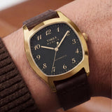 The Timex Marlin Chatham Automatic 36mm Watch TW2Y84500 pairs its compact 36mm gold-tone case with a brown leather strap on the wrist. The size sits comfortably on a wide range of wrists.