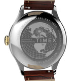 Close-up back view of a Timex wristwatch with a polished stainless steel case and a brown leather strap. The case is engraved with a globe design and text including 'TIMEX', 'WR 500H', 'STAINLESS STEEL', and 'THE WATERBURY COLLECTION'.