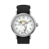 The Timex x Looney Tunes Weekender Quartz 40mm Watch TW2Y99100 has a white dial featuring Looney Tunes characters. The round silver-tone case frames the playful, nostalgic design.