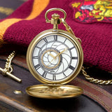 The Timex x Harry Potter Time Turner 48.5mm Pocket Watch TW2Y99600 opens to reveal a white dial with Roman numerals. The dial design is inspired by the Clock Tower of Hogwarts Castle.