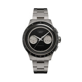 The Timex Atelier Chronograph Automatic M1a Ti Men's 42mm Watch TW6A02700 features a matte black dial with twin silver-tone sub-dials and a tachymeter scale on the bezel.