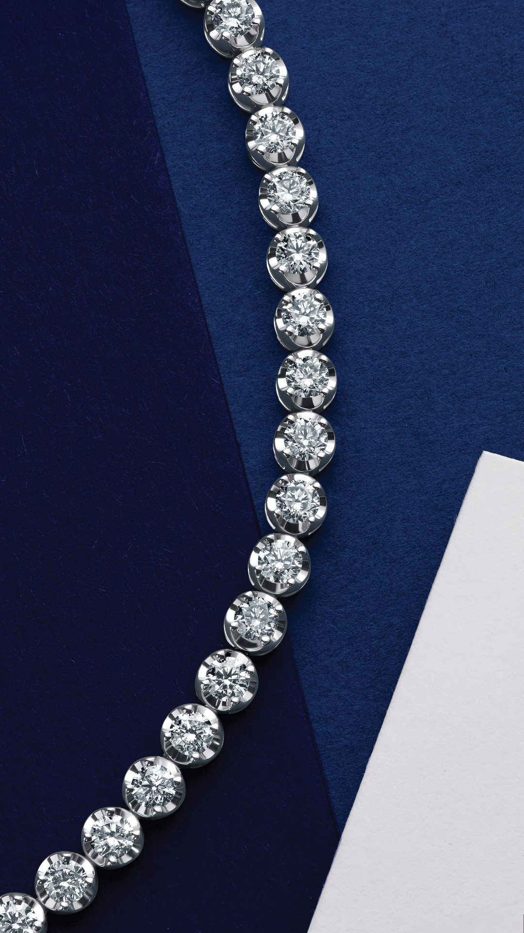 Diamond tennis bracelet on a blue and white background