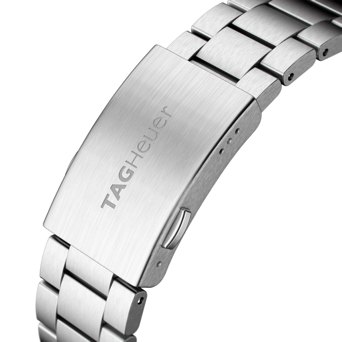 TAG Heuer Formula 1 Date WAZ2011.BA0842 photographed in close-up focusing on the steel bracelet's polished and brushed link detailing. The case is partially visible at the top of the frame, connecting to the bracelet via the lugs.