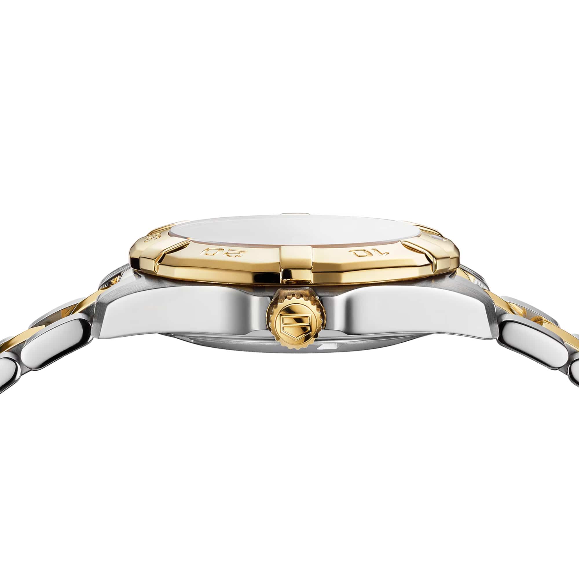 TAG Heuer Aquaracer Date WBD1322.BB0320 photographed from a side profile, showing the case thickness and screw-down gold-plated crown. The two-tone bracelet and bezel are visible together in frame.