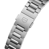 TAG Heuer Carrera Date WBN2110.BA0639 photographed in close-up focusing on the H-shaped steel bracelet's link detailing. The case is partially visible at the top of the frame, connecting to the bracelet via the lugs.