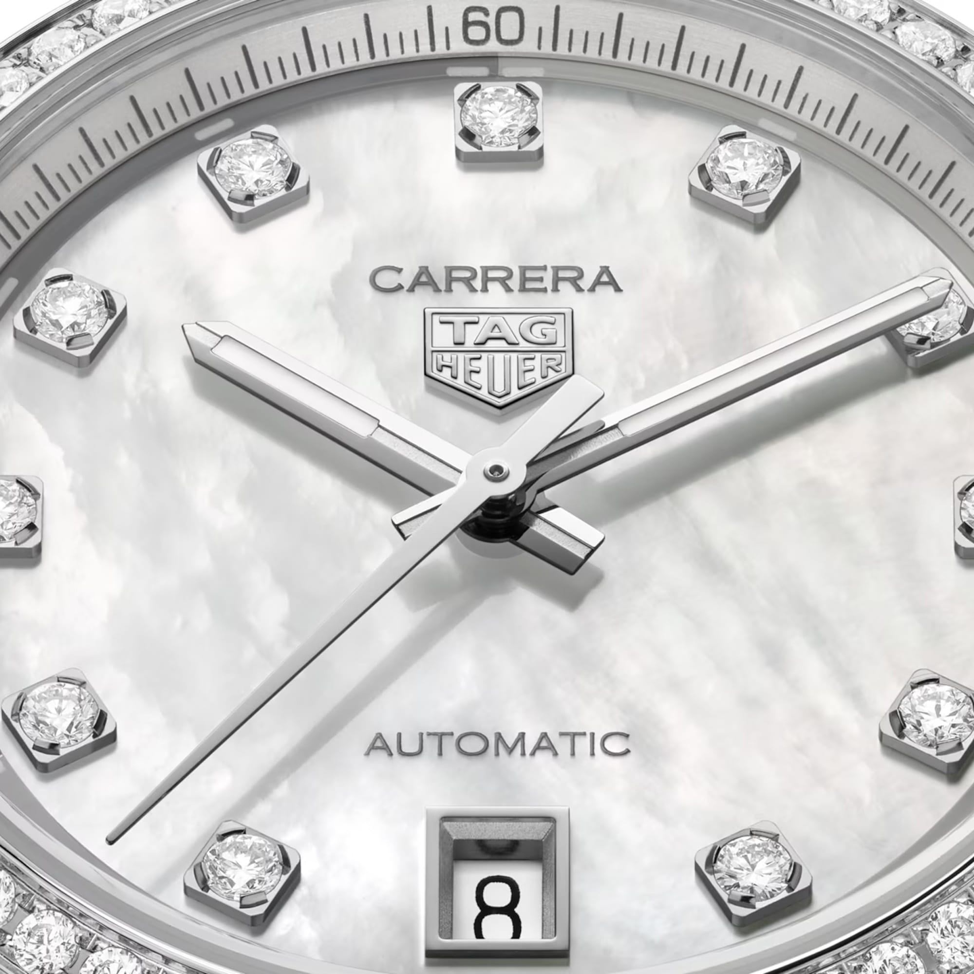 TAG Heuer Carrera Date WBN231E.BA0001 captured in extreme close-up on the mother-of-pearl dial, highlighting the diamond indexes and rhodium-plated faceted hands. The date window at 6 o'clock sits against the pearlescent dial surface.