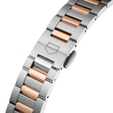TAG Heuer Carrera Date WBN2350.BD0000 photographed in close-up focusing on the two-tone steel and rose gold bracelet's link detailing. The case is partially visible at the top of the frame, connecting to the bracelet via the lugs.