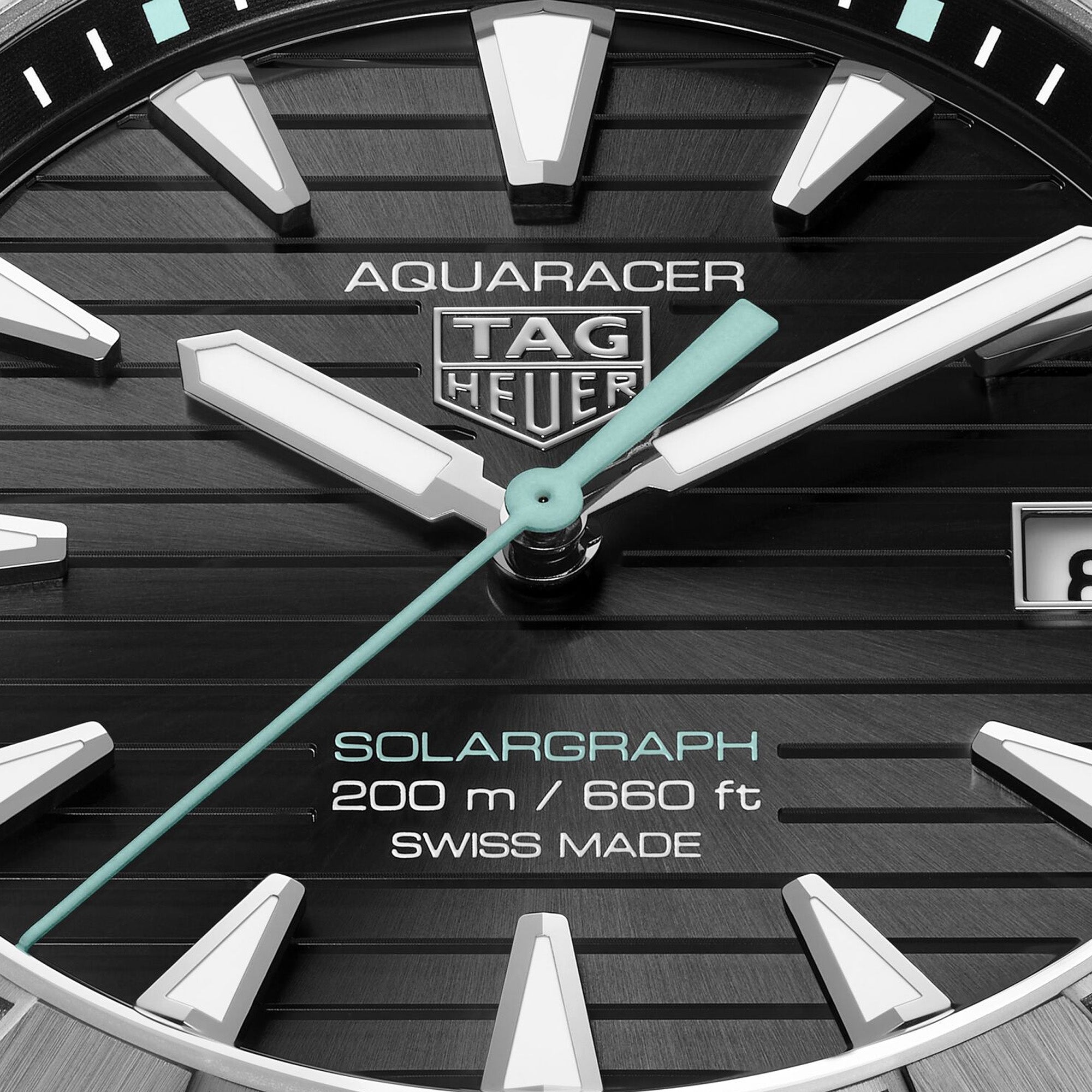 Close up - TAG Heuer Aquaracer Professional 200 Solargraph WBP1184.BF0008 titanium watch with black dial, rotating bezel, and solar-powered quartz movement.