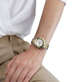 TAG Heuer Aquaracer Professional 200 Solargraph WBP1326.BB0004 shown worn on the wrist, illustrating the case proportions and two-tone bracelet fit. The mother-of-pearl dial stands out against the sleeve in frame.