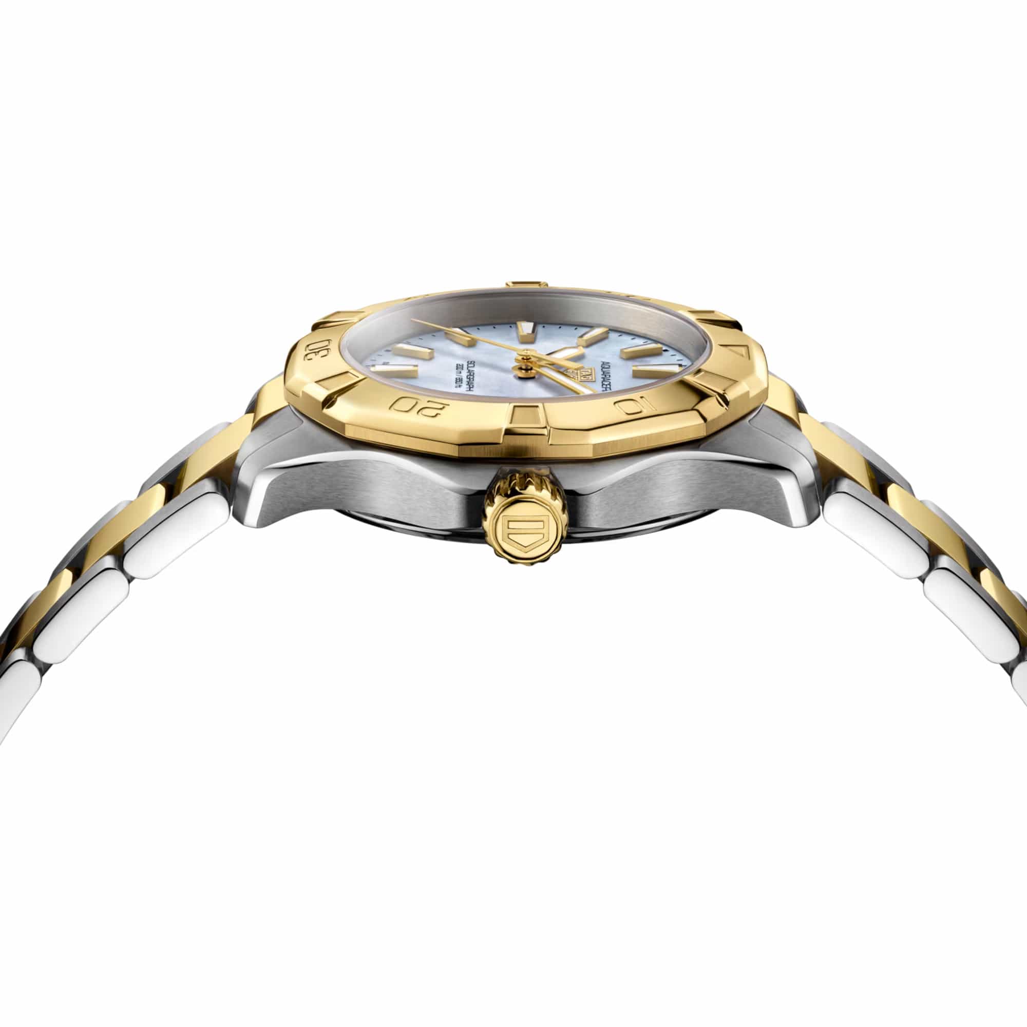 TAG Heuer Aquaracer Professional 200 Solargraph WBP1327.BB0004 photographed from a side profile, showing the case thickness and gold-plated screw-down crown. The two-tone bracelet and turning bezel are visible together in frame.