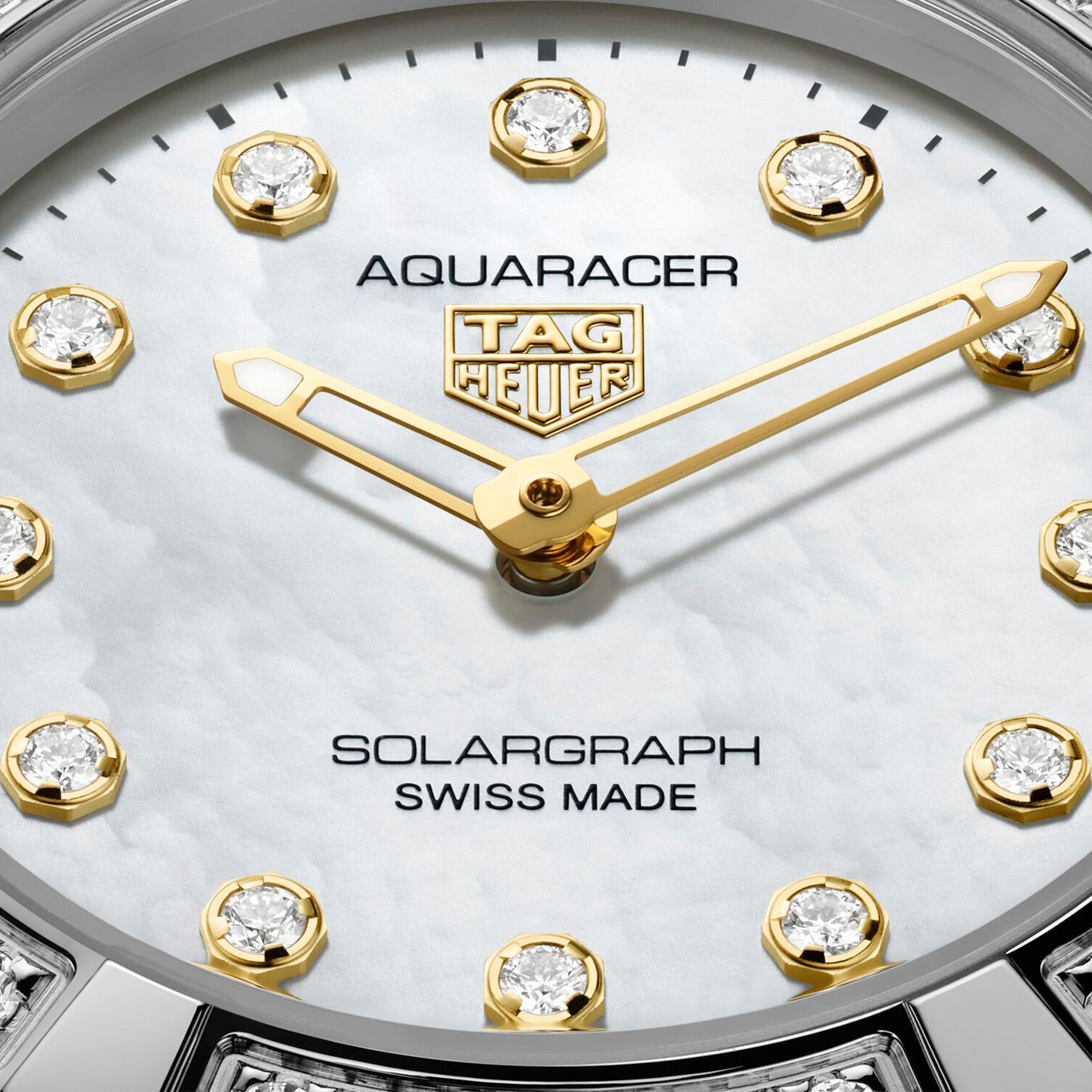 TAG Heuer Aquaracer Professional 100 Solargraph WBP141J.BA0049 steel watch with diamond-set bezel, white mother-of-pearl dial, and solar-powered quartz movement.