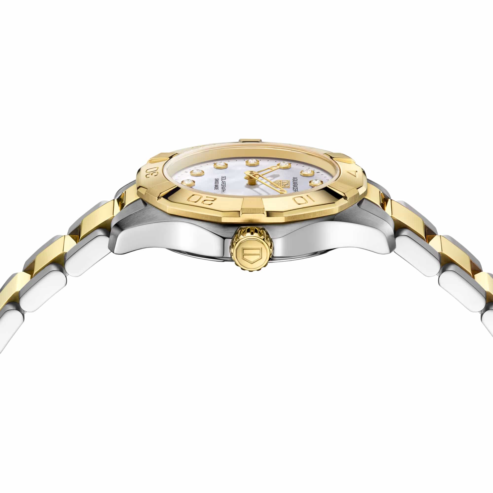 TAG Heuer Aquaracer Professional 100 Solargraph WBP1420.BB0006 photographed from a side profile, showing the case thickness and gold-plated crown. The two-tone bracelet and diamond-set bezel are visible together in frame.