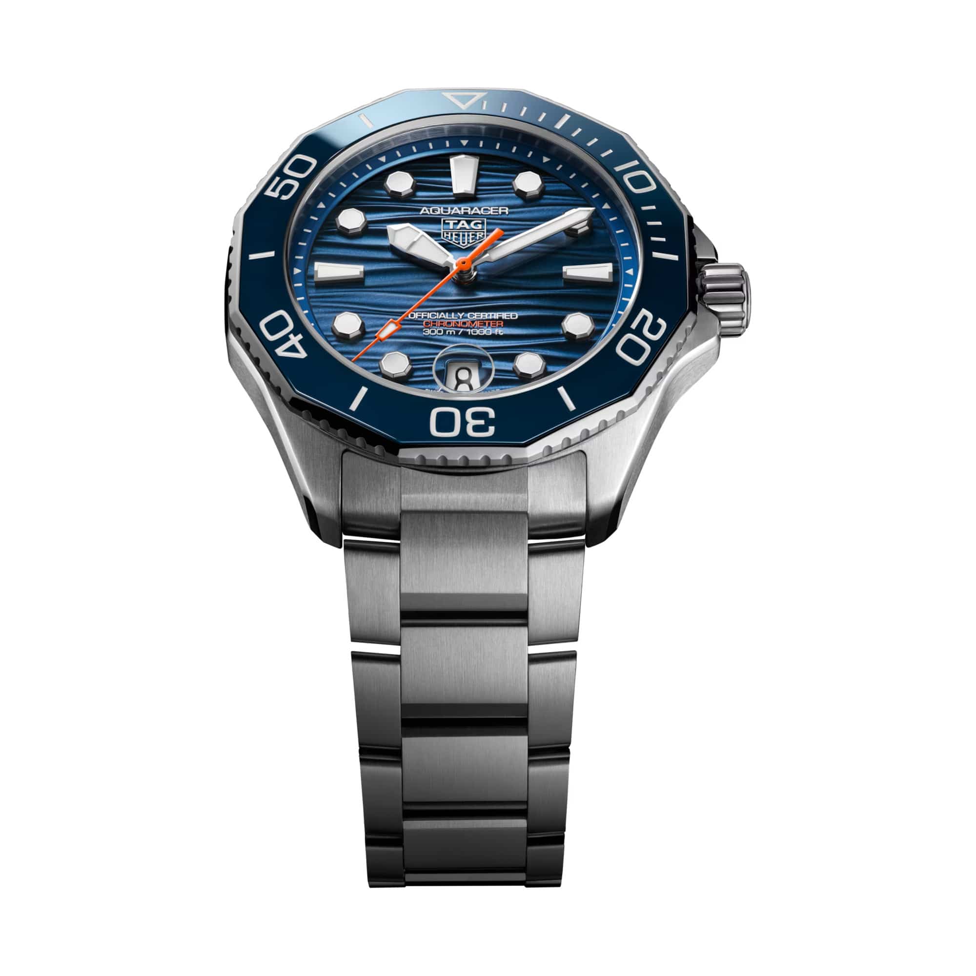 TAG Heuer Aquaracer Professional 300 Date WBP5111.BA0013 shown at an angle combining the blue dial, ceramic bezel, and steel bracelet in one frame. The orange central seconds hand catches the light against the blue dial surface.