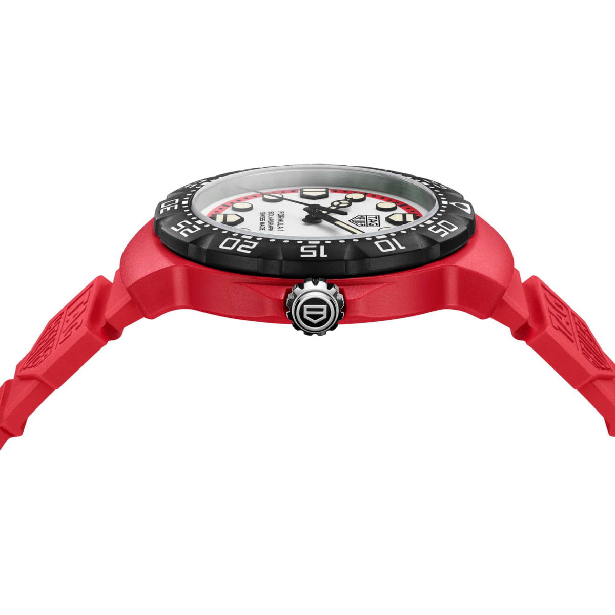 TAG Heuer Formula 1 Solargraph WBY1161.FT8086 photographed from a side profile, showing the case thickness and steel crown. The red rubber strap and black bezel are visible together in frame.