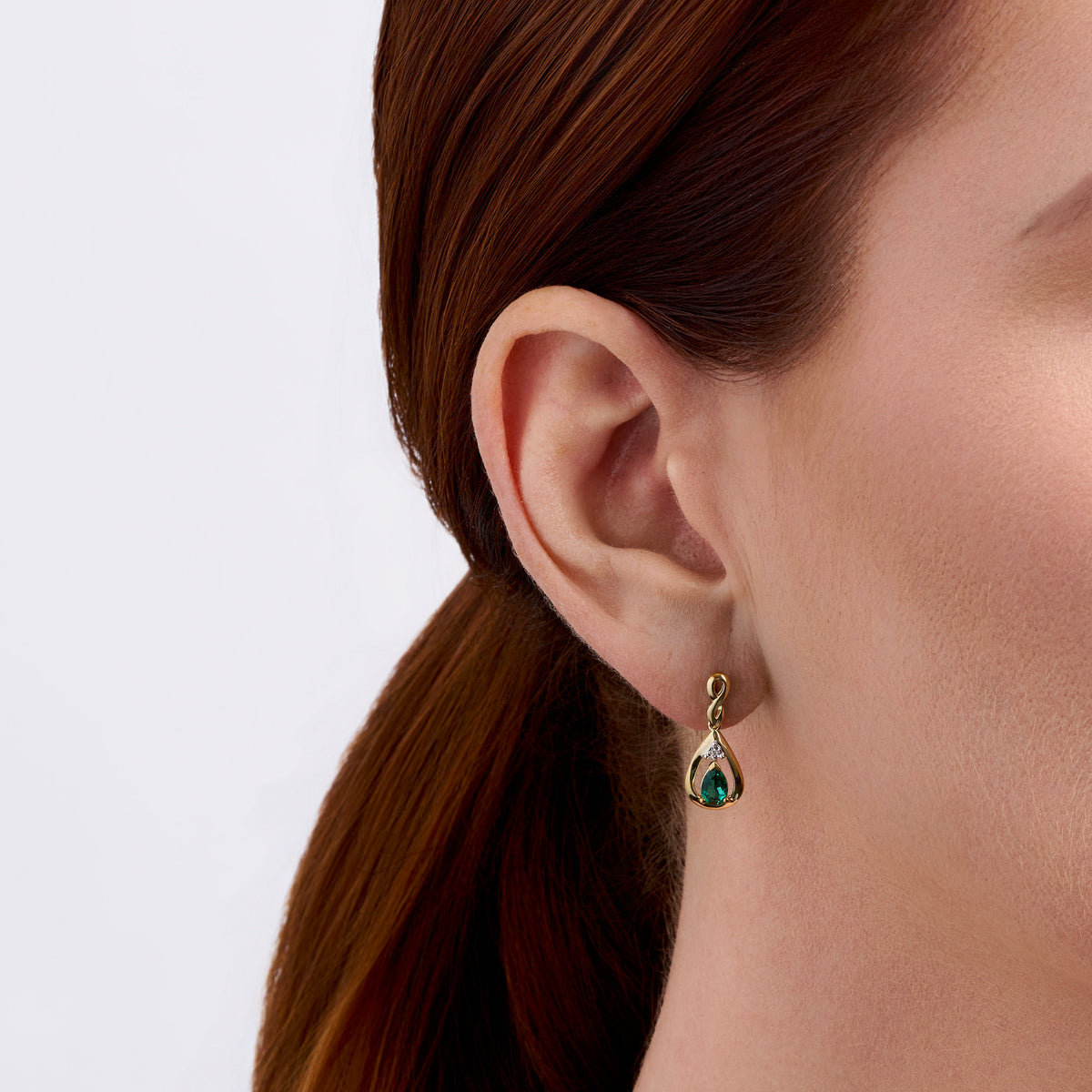 Emerald & Diamond Twist Pear Shape Drop Earrings in 9ct Yellow Gold