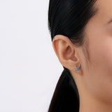 On-body view of a model wearing the Wallace Bishop Bluebird of Happiness Stud Earrings in 9ct Yellow Gold, 12 x 7.70mm, with the blue enamel bluebirds in the earlobes.