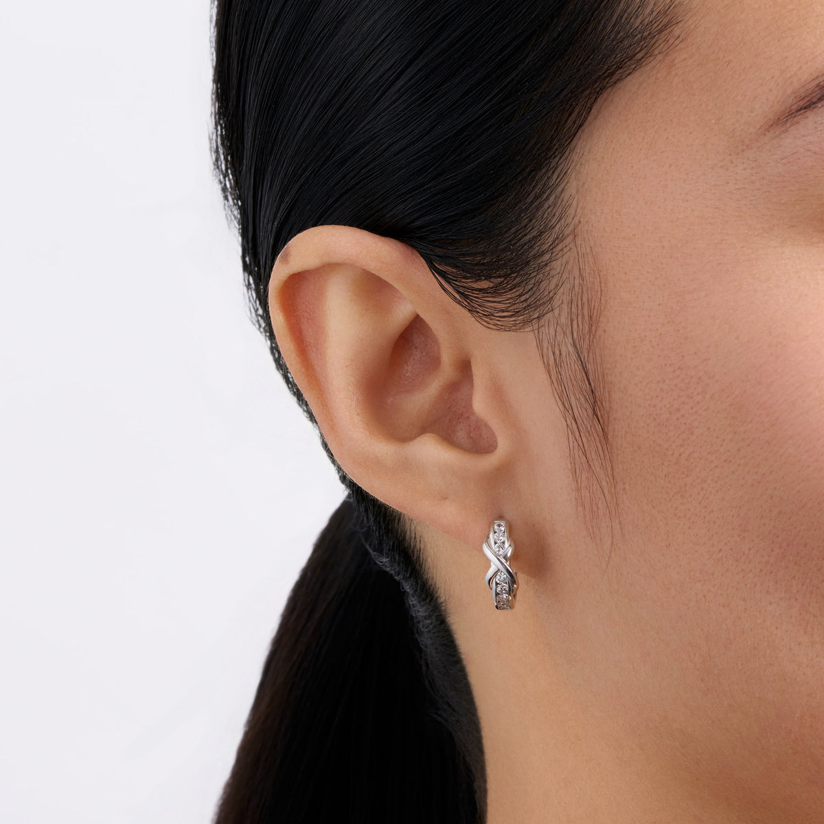 Cubic Zirconia Polished Huggies Earrings in Sterling Silver