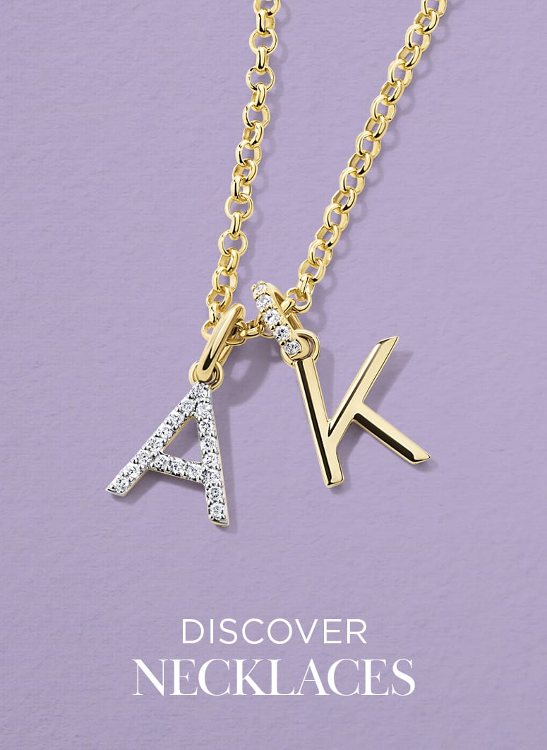Necklace with 'AK' letter charms on a purple background