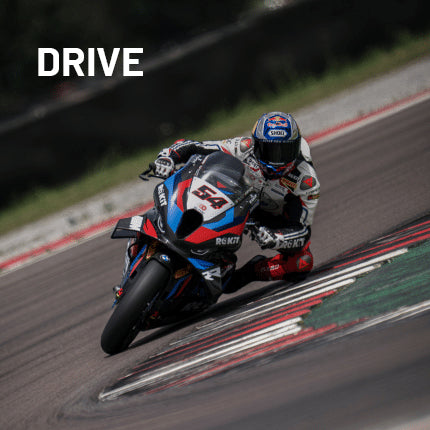 Racing motorcycle on a track with a rider, blurred background