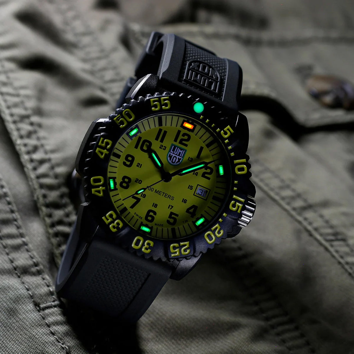 Luminox Sea Lion Men's 44mm Carbonox Quartz Watch X2.2055.1 shown in an outdoor water setting. This Luminox G Collection dive watch features a bright yellow dial, a lightweight black CARBONOX™ case and 100m water resistance.