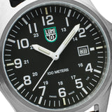 Close-up of the black dial on the Luminox Patagonia Steel Men's 43mm Quartz Watch X2.2501, showing the large white numerals, hands and date window. This Luminox G-Collection watch features self-powered tritium tubes on the hands and markers for constant visibility.