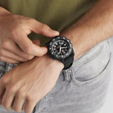 Luminox F-117 Nighthawk Men's 44mm Quartz GMT Watch XA.6441 worn on the wrist to show its size and fit. This F-117 Nighthawk pilot's watch features a black dial, an angled rotating bezel and a lightweight black CARBONOX™+ case on a black Kevlar strap.
