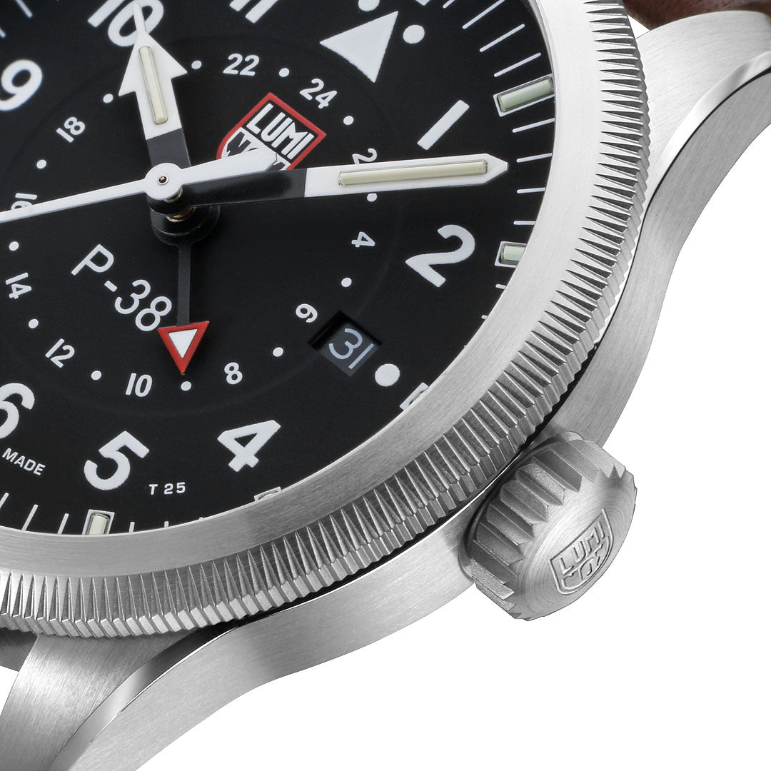 Luminox Air Pilot P-38 Lightning Men's 42mm Quartz GMT Watch XA.9521 shown in an aviation-inspired setting. This P-38 Lightning pilot's watch features a black dial, a second time zone function and a brown leather strap.