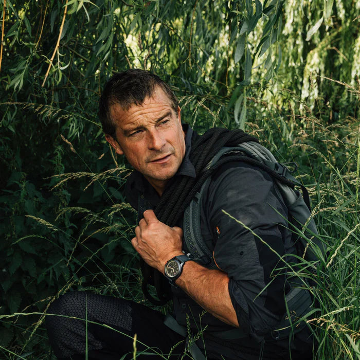 Luminox Bear Grylls Survival Land Men's 43mm Quartz Watch XB.3716 worn on the wrist to show its size and fit. This Bear Grylls Survival Land 3710 Series watch features a sand-coloured dial, an orange crown and a lightweight ALUMI-NOX aluminium case on a black rubber strap.
