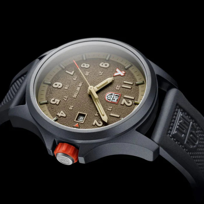 Three-quarter angle view of the Luminox Bear Grylls Survival Land Men's 43mm Quartz Watch XB.3716 showing the case profile and signature orange crown. This Bear Grylls Survival Land 3710 Series watch pairs a lightweight ALUMI-NOX aluminium case with a sand-coloured dial under sapphire crystal.