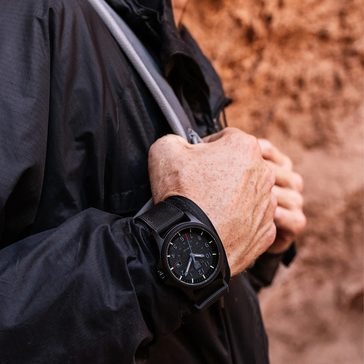 Luminox Atacama Field Men's 43mm Quartz Watch XL.1961 worn on the wrist to show its size and fit. This Atacama Field watch features a textured black dial and a lightweight black CARBONOX™ case on a black rubber strap.