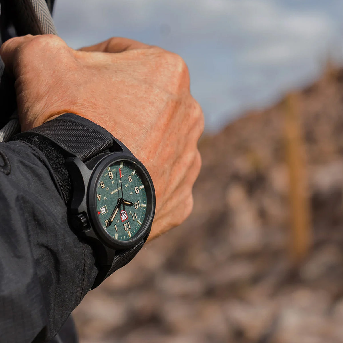 Luminox Atacama Field Men's 43mm Quartz Watch XL.1961 worn on the wrist to show its size and fit. This Atacama Field watch features a textured black dial and a lightweight black CARBONOX™ case on a black rubber strap.