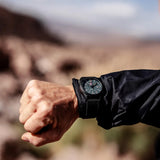 Luminox Atacama Field Men's 43mm Quartz Watch XL.1961 worn on the wrist to show its size and fit. This Atacama Field watch features a textured black dial and a lightweight black CARBONOX™ case on a black rubber strap.