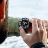 Luminox MIL-SPEC Inspired Men’s 46mm Quartz Watch XL.3355.2 worn on the wrist to show its size and fit. This MIL-SPEC 3350 Series military watch features a blue dial and a lightweight CARBONOX™+ case on a blue rubber strap.
