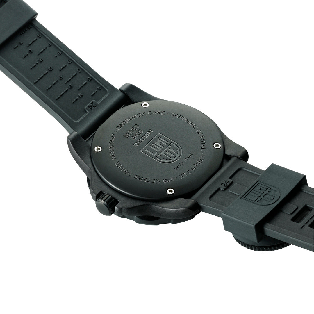 Back view of the Luminox RECON Nav Spec Men's 46mm Quartz GMT Watch XL.8833 showing the solid case back. This RECON Nav Spec watch is water resistant to 200m and comes on a black rubber strap with map scales and ruler markings.
