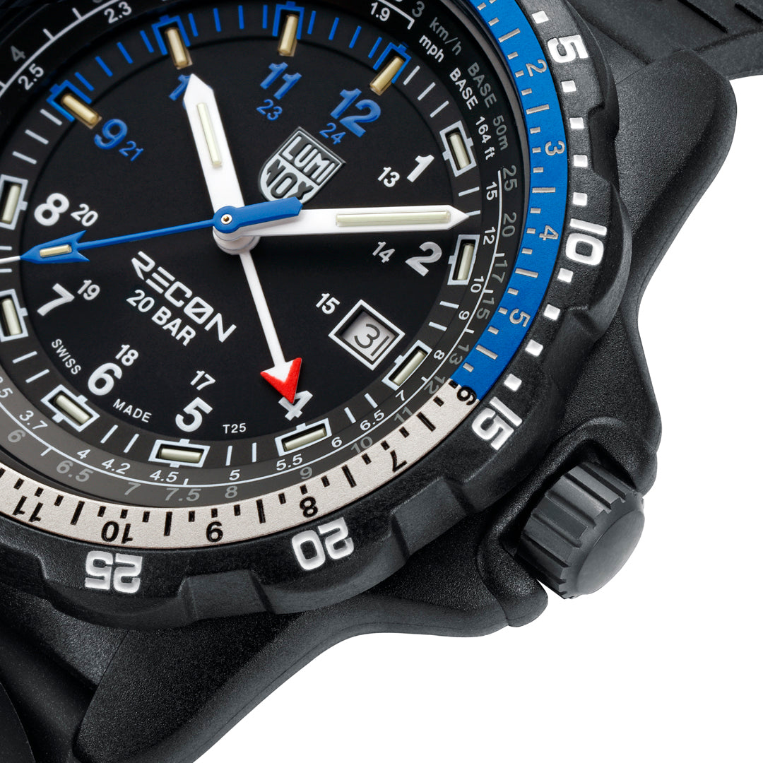 Close-up of the black dial on the Luminox RECON Nav Spec Men's 46mm Quartz GMT Watch XL.8833, showing the white 12 and 24-hour numerals, blue 9 to 12 markers, blue seconds hand and GMT hand. This RECON Nav Spec watch features self-powered tritium tubes for constant visibility in the dark.