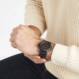 Luminox Leatherback SEA Turtle Giant Men's 44mm Quartz Watch XS.0321.BO.L worn on the wrist to show its size and fit. This Leatherback SEA Turtle Giant Blackout watch features a black-on-black dial and a lightweight black CARBONOX™ case on a black strap.