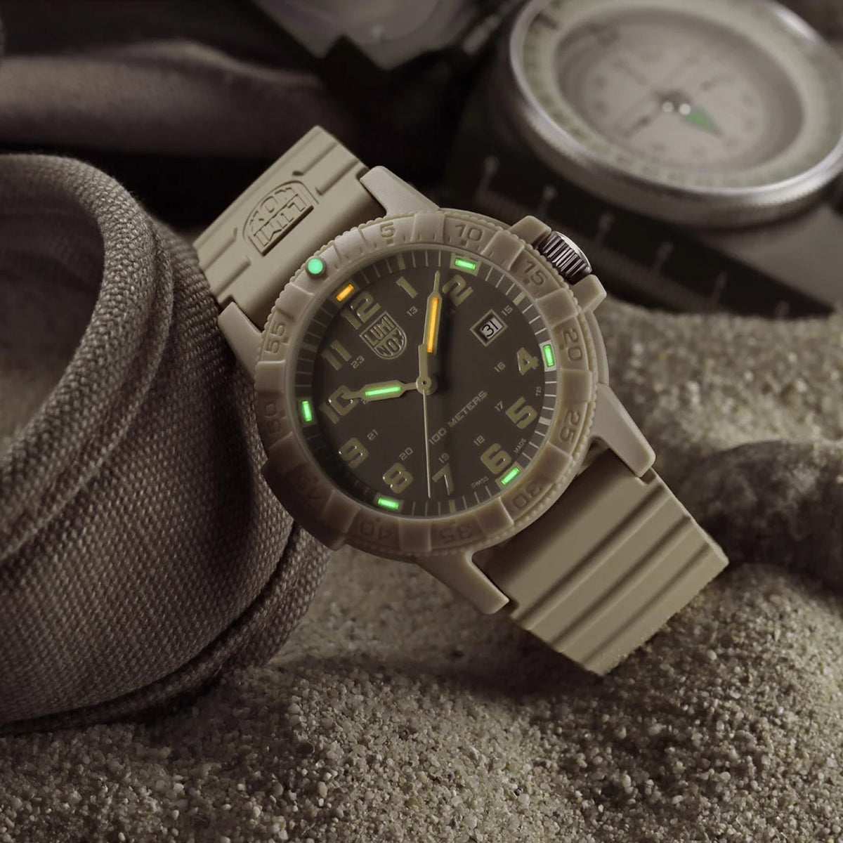 Luminox Leatherback SEA Turtle Giant Men’s 44mm Quartz Watch XS.0326 shown in a desert outdoor setting. This Leatherback SEA Turtle Giant watch features a monochromatic sand design, a lightweight CARBONOX™ case and 100m water resistance.