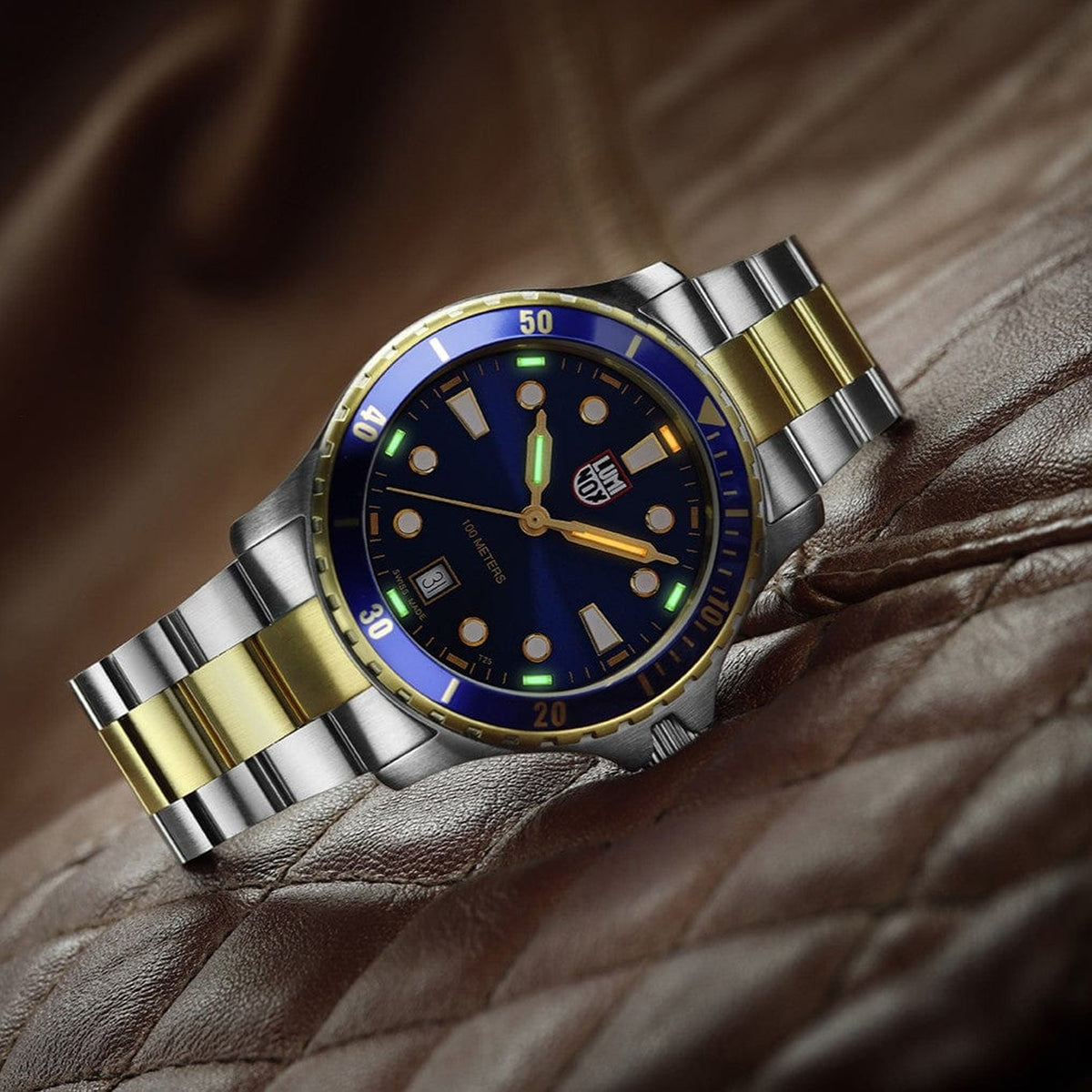 Luminox Sport Timer Men's 40mm Quartz Watch XS.0944 shown in a relaxed everyday setting. This Sport Timer 0940 Series watch features a blue sunray dial, gold-tone accents and 100m water resistance.