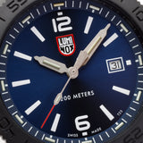 Close-up of the ocean blue sunray dial on the Luminox Pacific Diver Men's 44mm Quartz Watch XS.3123.B, showing the white numerals, hands and date window. This Pacific Diver 3120 Series watch features self-powered tritium tubes on the hands and markers for constant visibility in the dark.