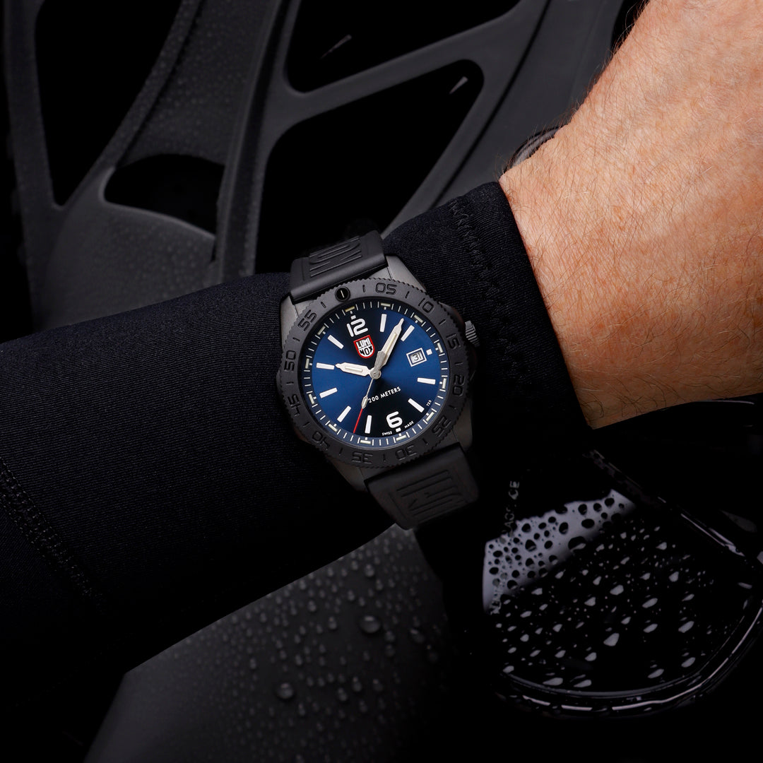 Luminox Pacific Diver Men's 44mm Quartz Watch XS.3123.B worn on the wrist to show its size and fit. This Pacific Diver 3120 Series watch features an ocean blue sunray dial, a black CARBONOX™ dive bezel and a black IP stainless steel case on a black rubber strap.