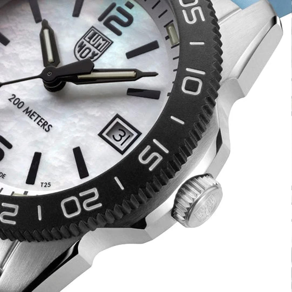 Close-up of the blue mother-of-pearl dial on the Luminox Pacific Diver Ripple Men's 39mm Quartz Watch XS.3124M, showing its natural shimmer, luminous hands and hour markers. This Pacific Diver Ripple dive watch features a date window and self-powered tritium tubes that glow constantly for up to 25 years.