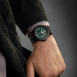 Luminox Pacific Diver Men's 44mm Quartz Watch XS.3137.B worn on the wrist to show its size and fit. This Pacific Diver 3120 Series watch features an emerald green sunray dial, a black CARBONOX™ dive bezel and a black IP stainless steel case on a black rubber strap.