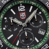 Close-up of the forest green dial on the Luminox Pacific Diver Chronograph Men’s 44mm Quartz Watch XS.3147, showing the white numerals and markers, three chronograph sub-dials and date window. This Pacific Diver Chronograph features self-powered tritium tubes for constant visibility in the dark.