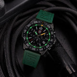 Luminox Pacific Diver Chronograph Men’s 44mm Quartz Watch XS.3147 shown in a forest outdoor setting. This Pacific Diver Chronograph features a forest green dial, a black IP stainless steel case and 200m water resistance.