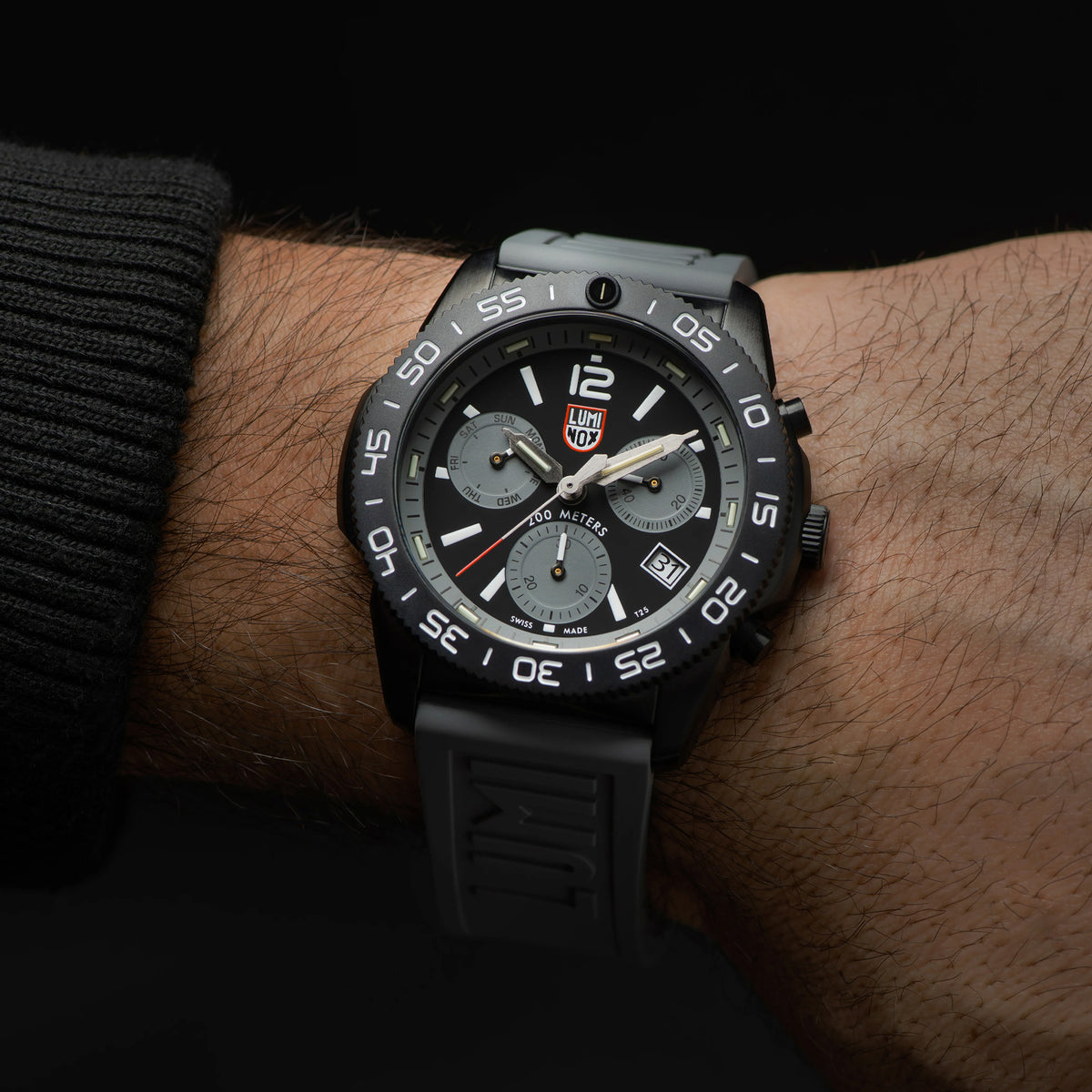 Luminox Pacific Diver Chronograph Men’s 44mm Quartz Watch XS.3148 worn on the wrist to show its size and fit. This Pacific Diver Chronograph features a graphite grey dial with three sub-dials and a black CARBONOX™ dive bezel on a grey rubber strap.