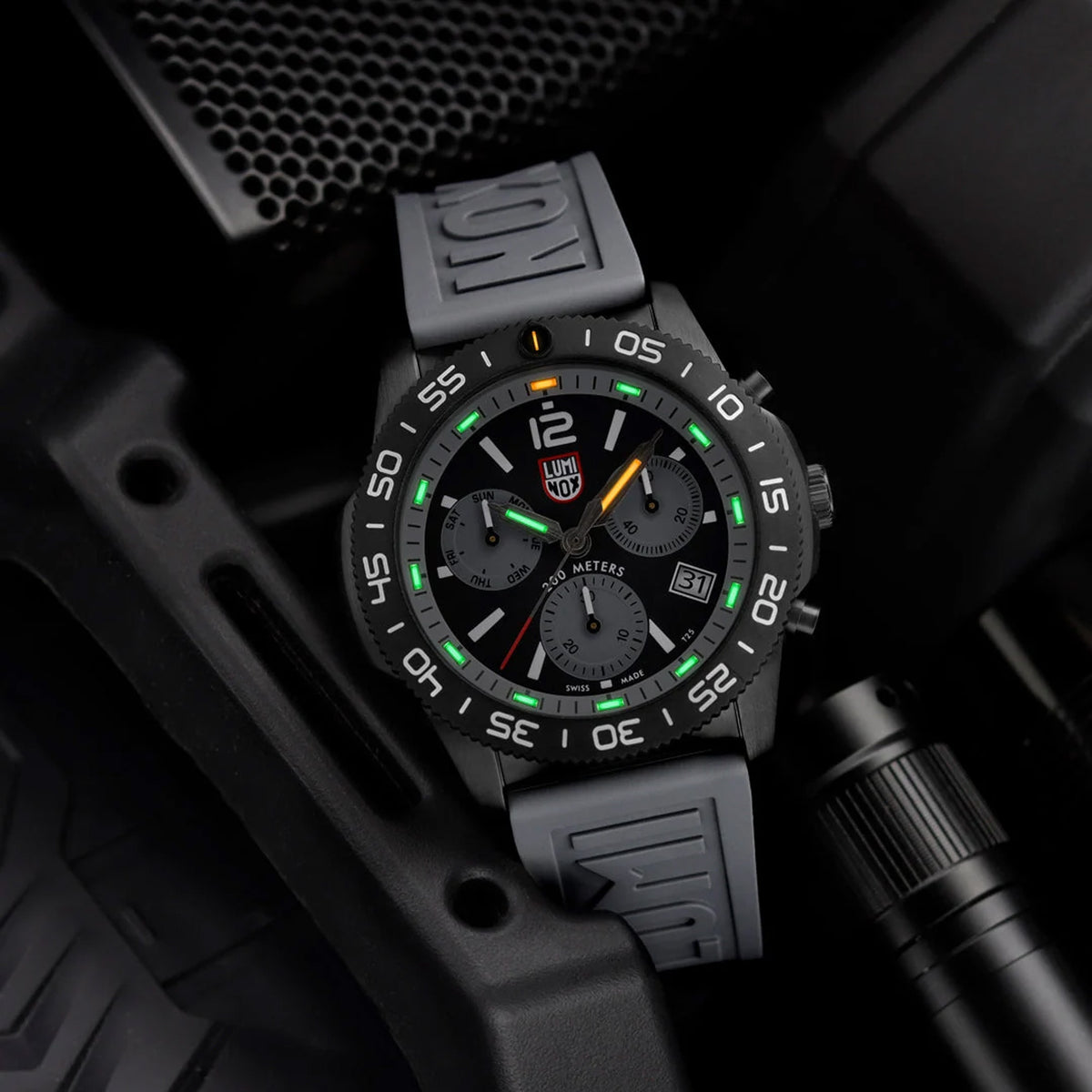 Luminox Pacific Diver Chronograph Men’s 44mm Quartz Watch XS.3148 shown in a rugged mountain setting. This Pacific Diver Chronograph features a graphite grey dial, a black IP stainless steel case and 200m water resistance.