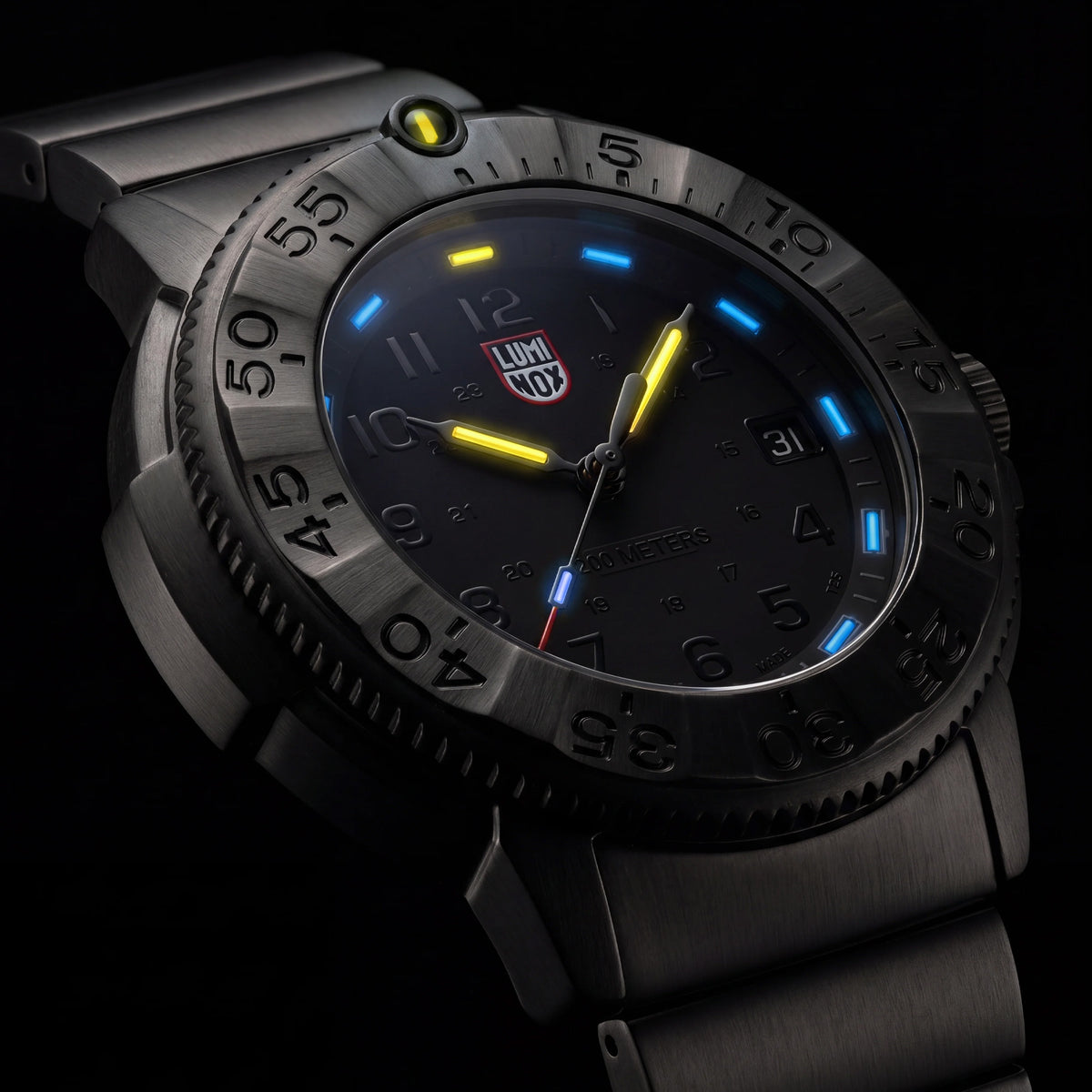 Luminox Navy SEAL Foundation Men’s 43mm Quartz Watch XS.3228.NSF shown in a rugged outdoor setting. This Navy SEAL Foundation 3220 Series dive watch features a black dial, a gunmetal steel bracelet and 200m water resistance.