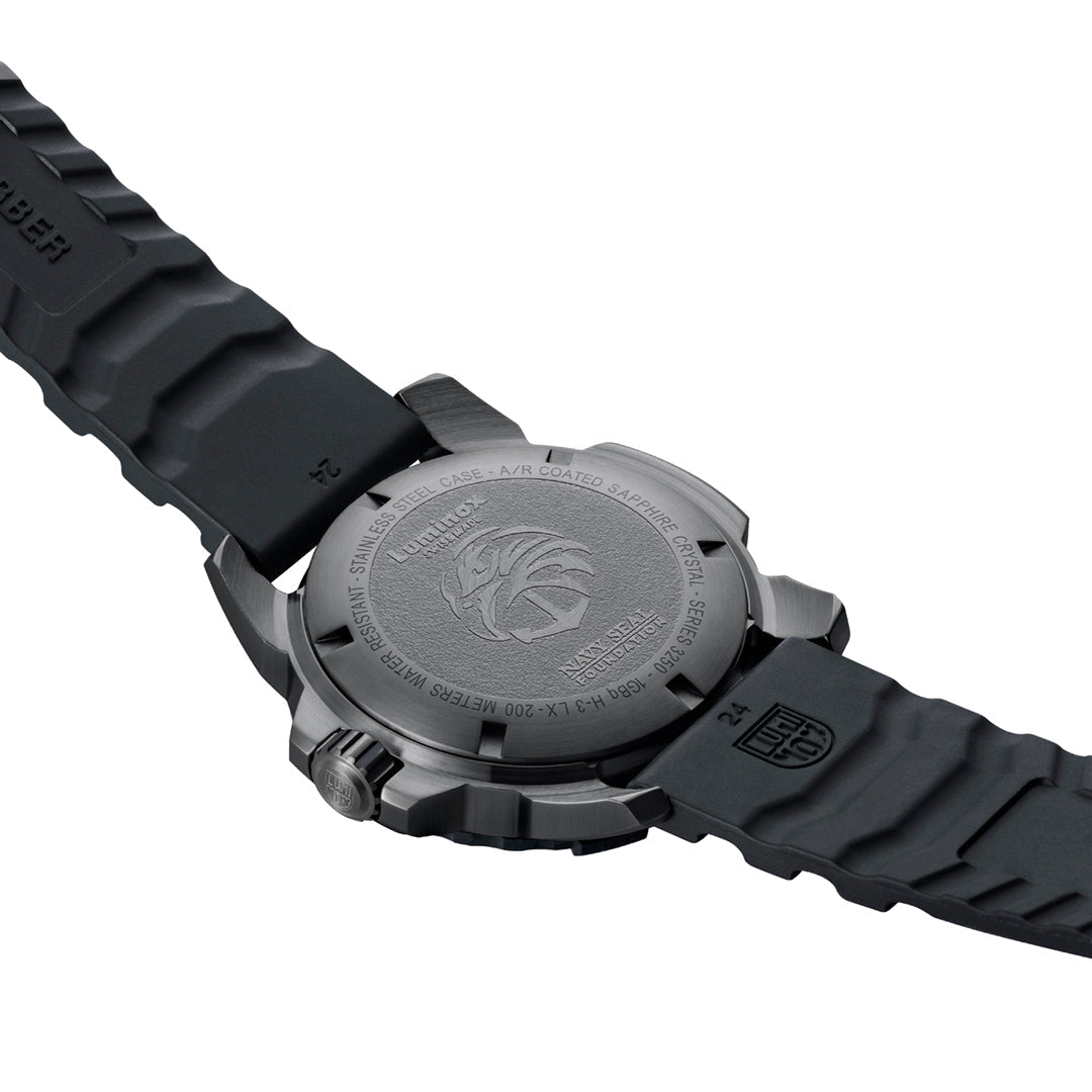 Photo taken from behind of a Luminox watch with a black strap.