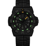 Luminox Navy SEAL Men's 45mm Quartz Watch XS.3510 glowing in the dark with Luminox Light Technology. The self-powered tritium gas tubes on the hands and hour markers of this Navy SEAL 3500 Series watch glow constantly for up to 25 years.